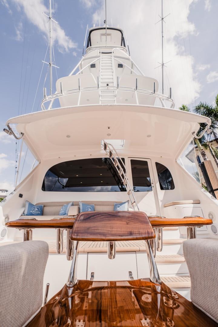 a boat with a table and chairs aboard AUSPICIOUS Yacht for Sale