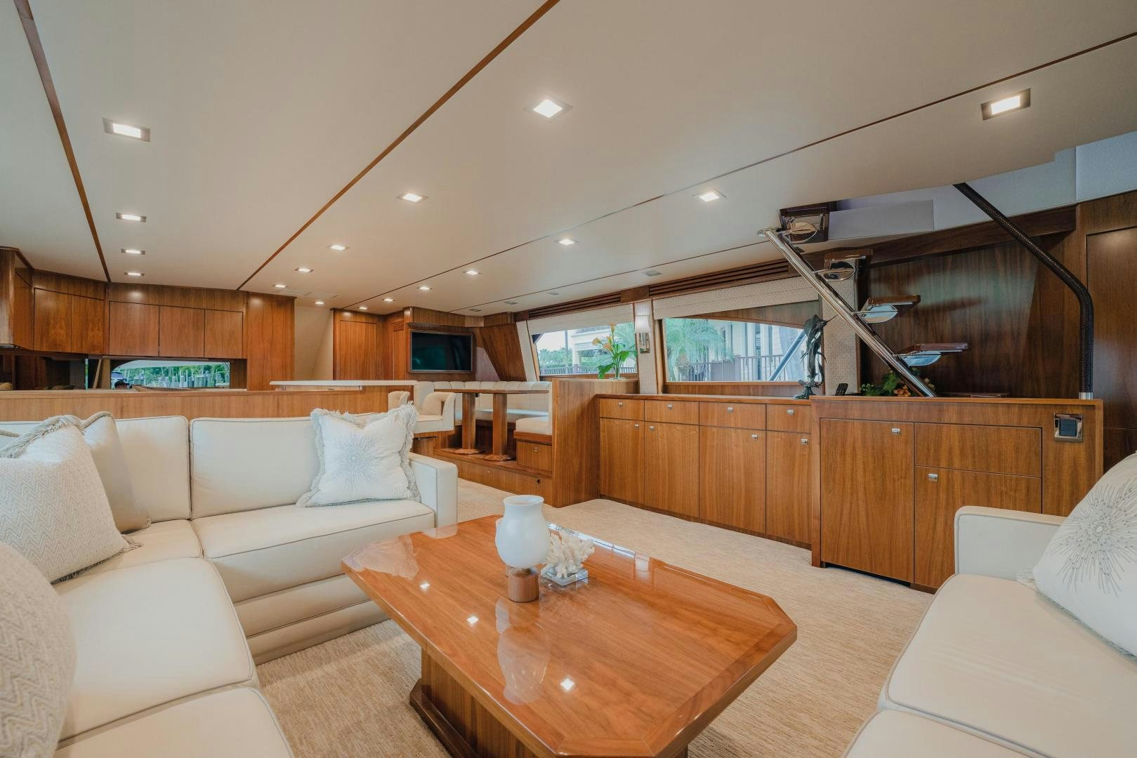 a living room with a wood table aboard AUSPICIOUS Yacht for Sale