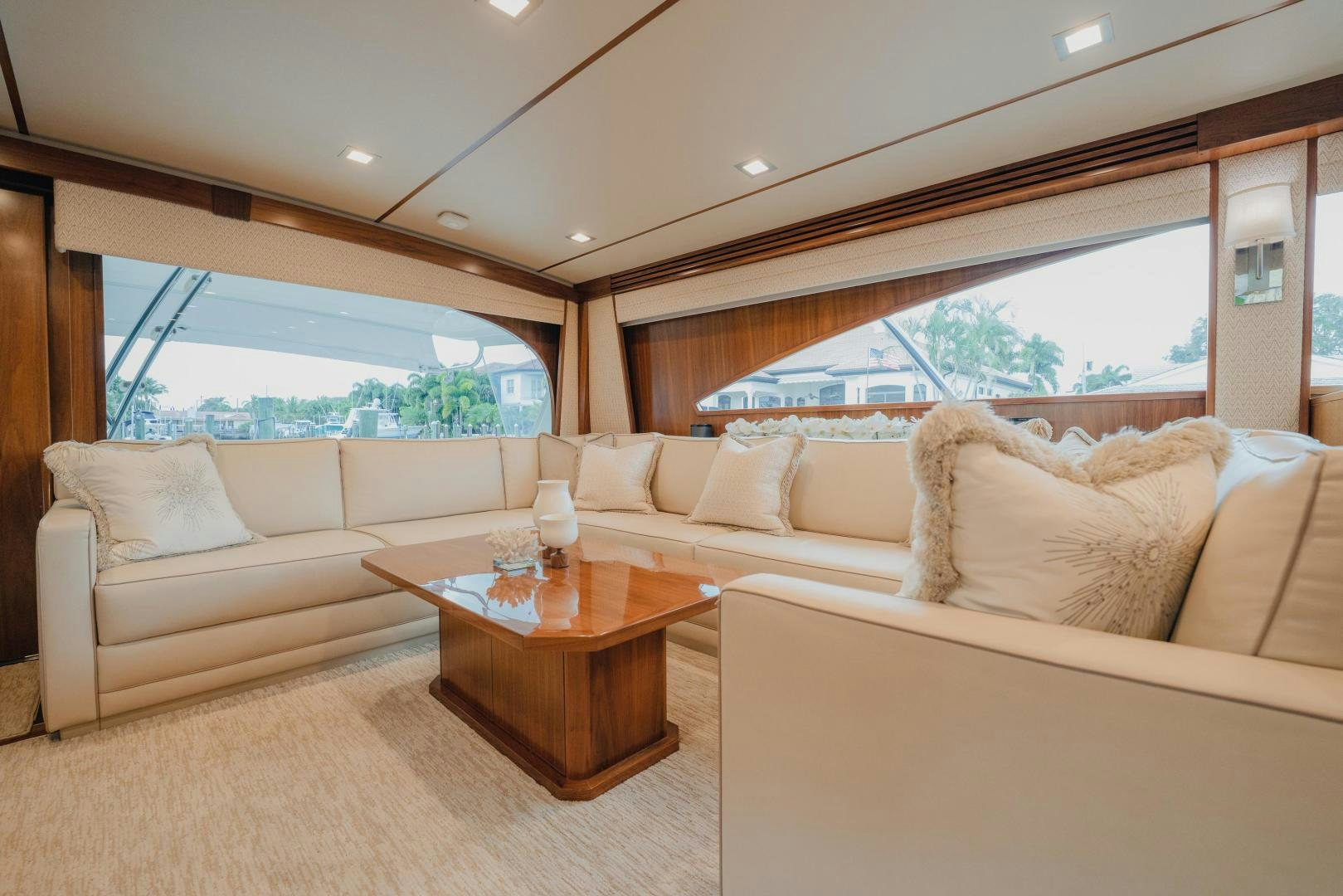 a living room with a couch and a table aboard AUSPICIOUS Yacht for Sale
