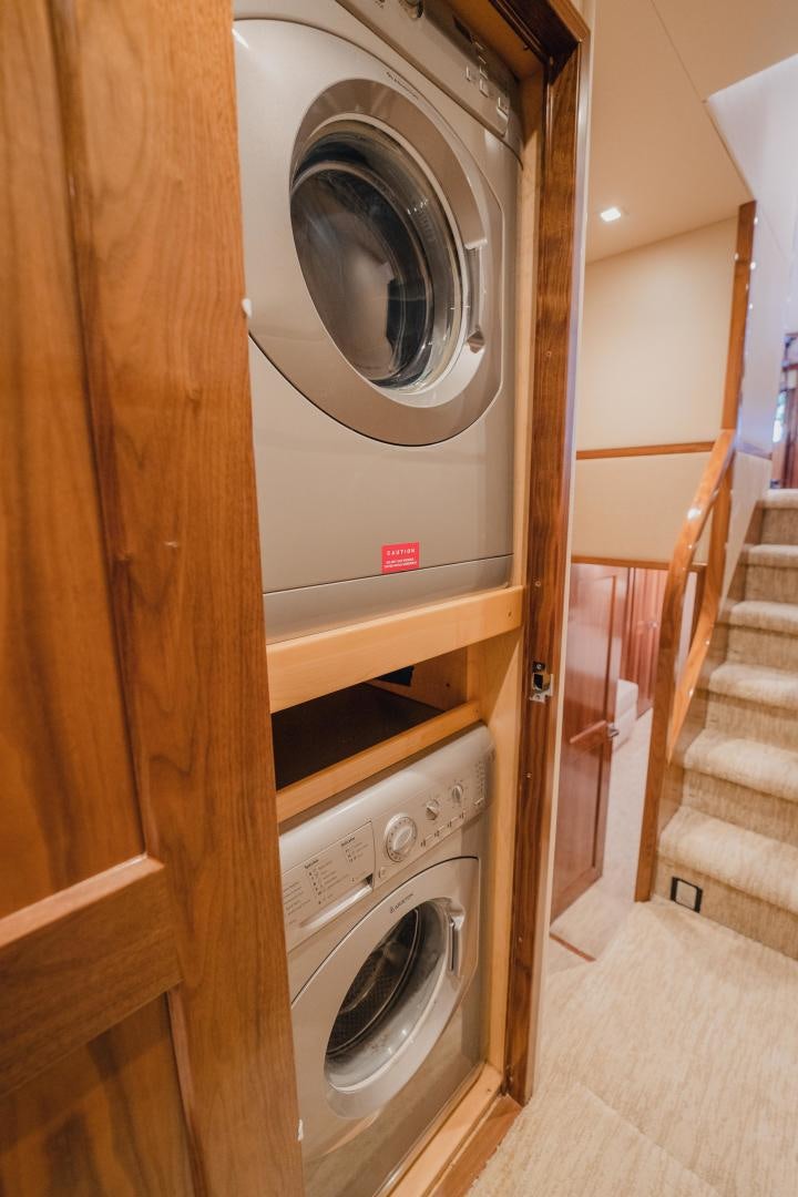 a washer and dryer in a room aboard AUSPICIOUS Yacht for Sale