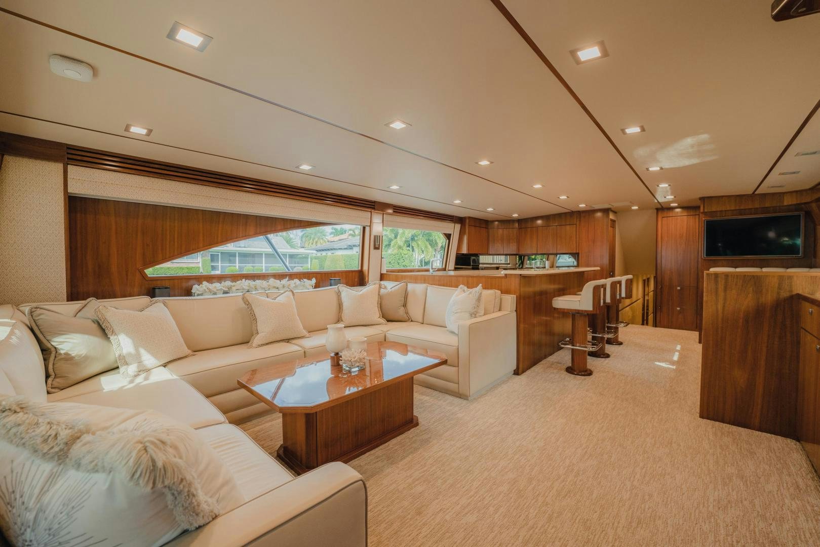 a living room with a large screen aboard AUSPICIOUS Yacht for Sale