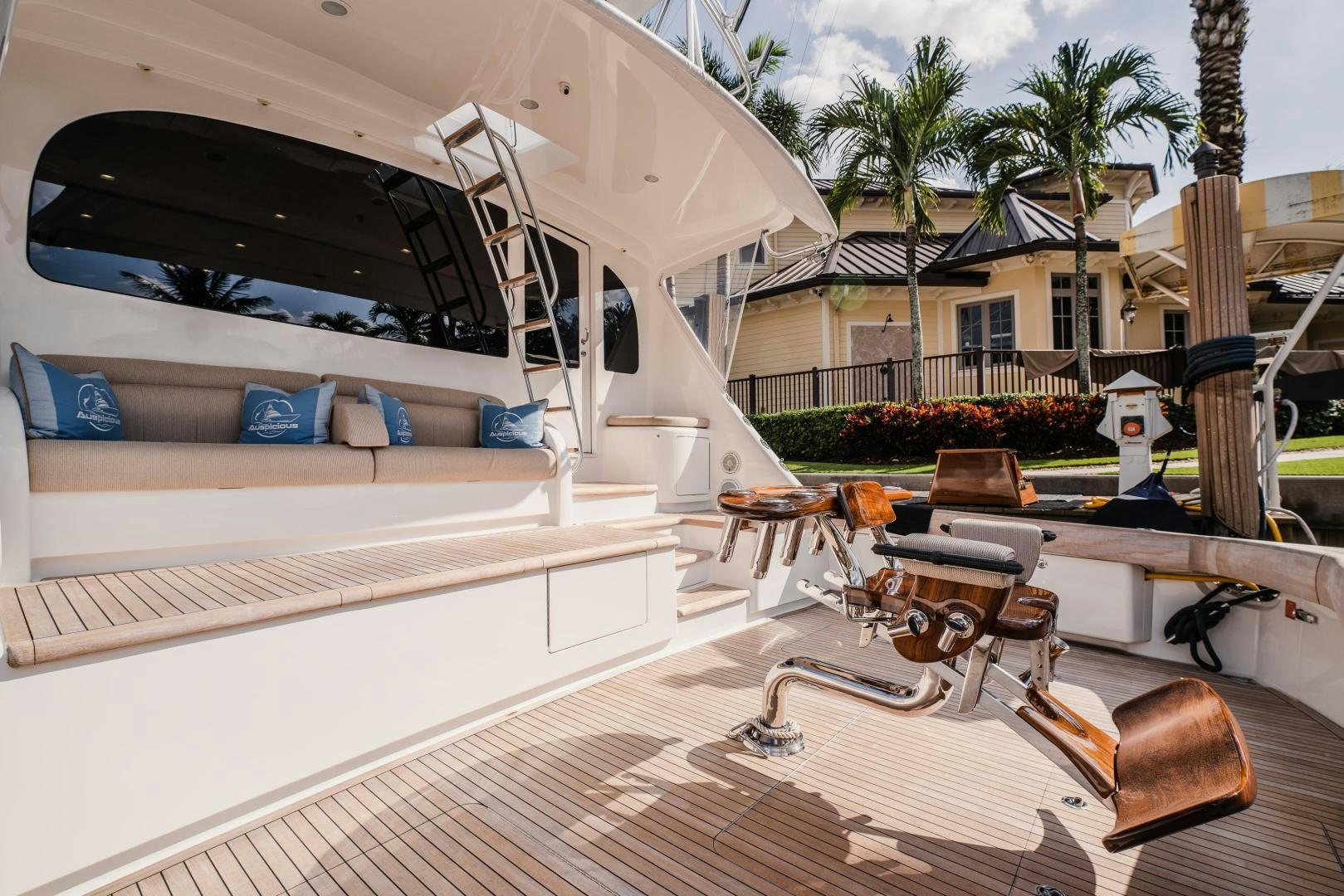 a deck with a pool and a deck and chairs aboard AUSPICIOUS Yacht for Sale