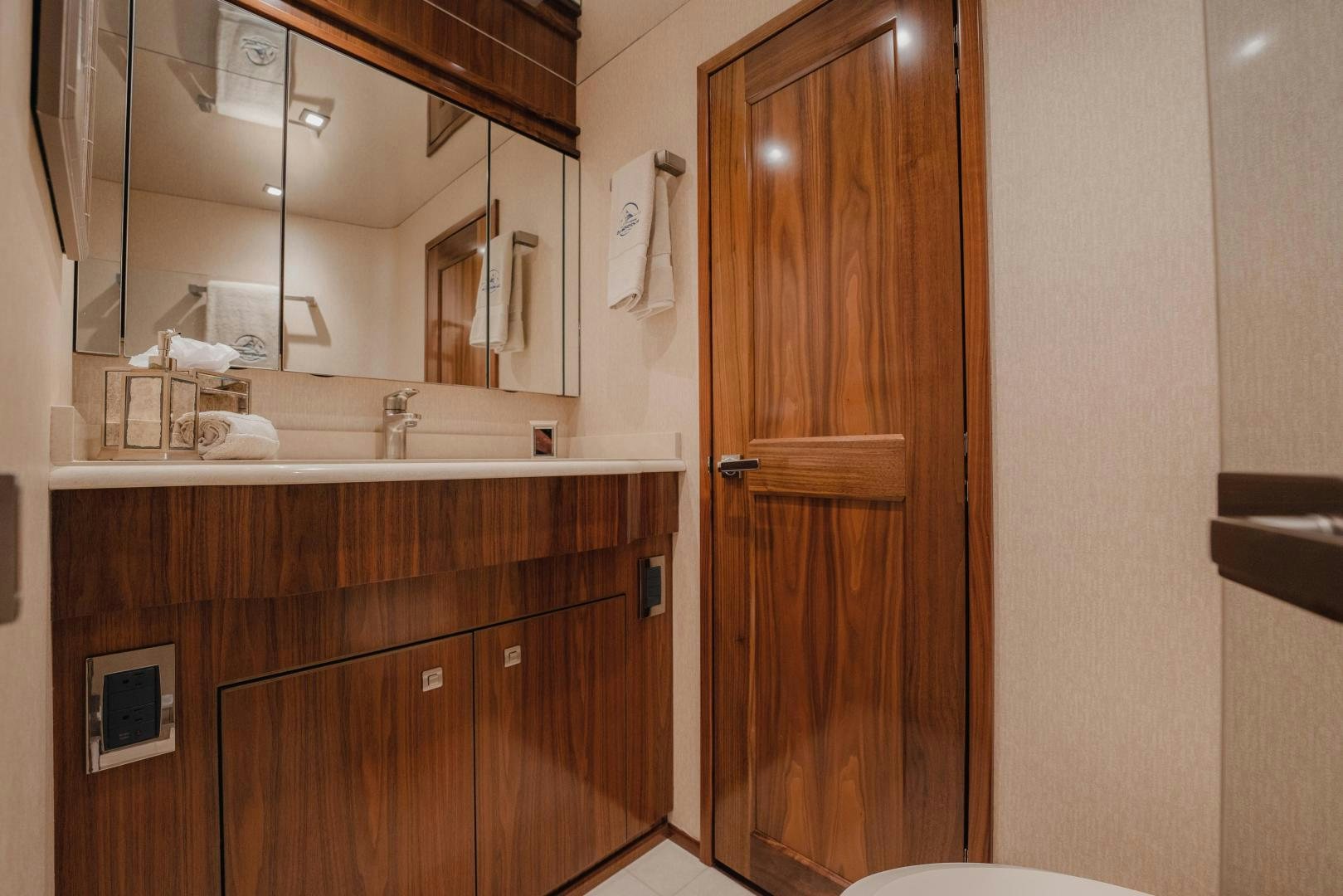 a bathroom with a large mirror aboard AUSPICIOUS Yacht for Sale