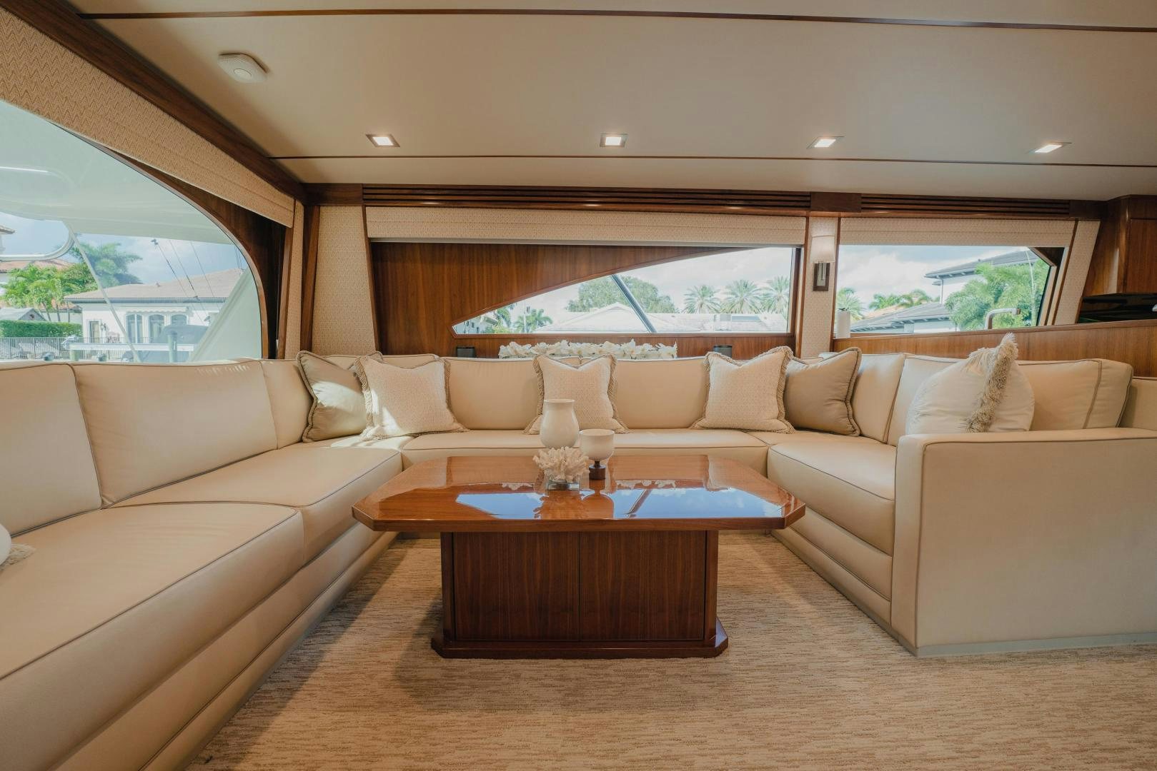 a living room with a couch and a coffee table aboard AUSPICIOUS Yacht for Sale