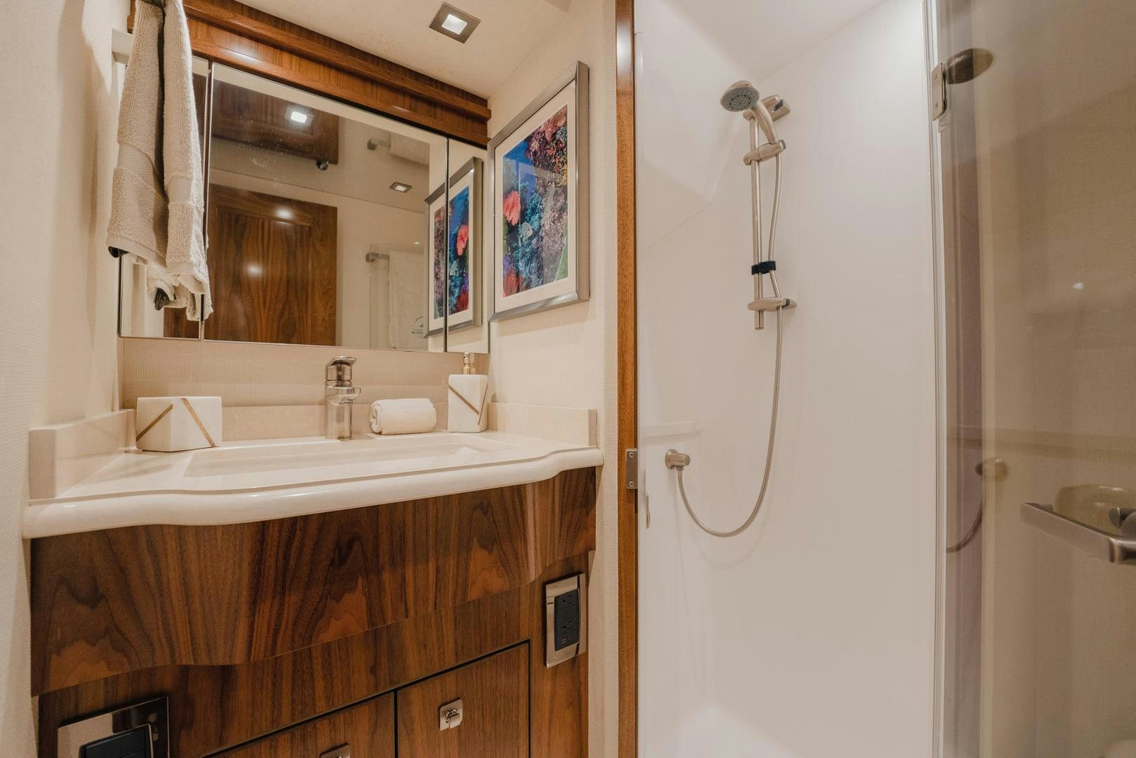 a bathroom with a mirror and a sink aboard AUSPICIOUS Yacht for Sale