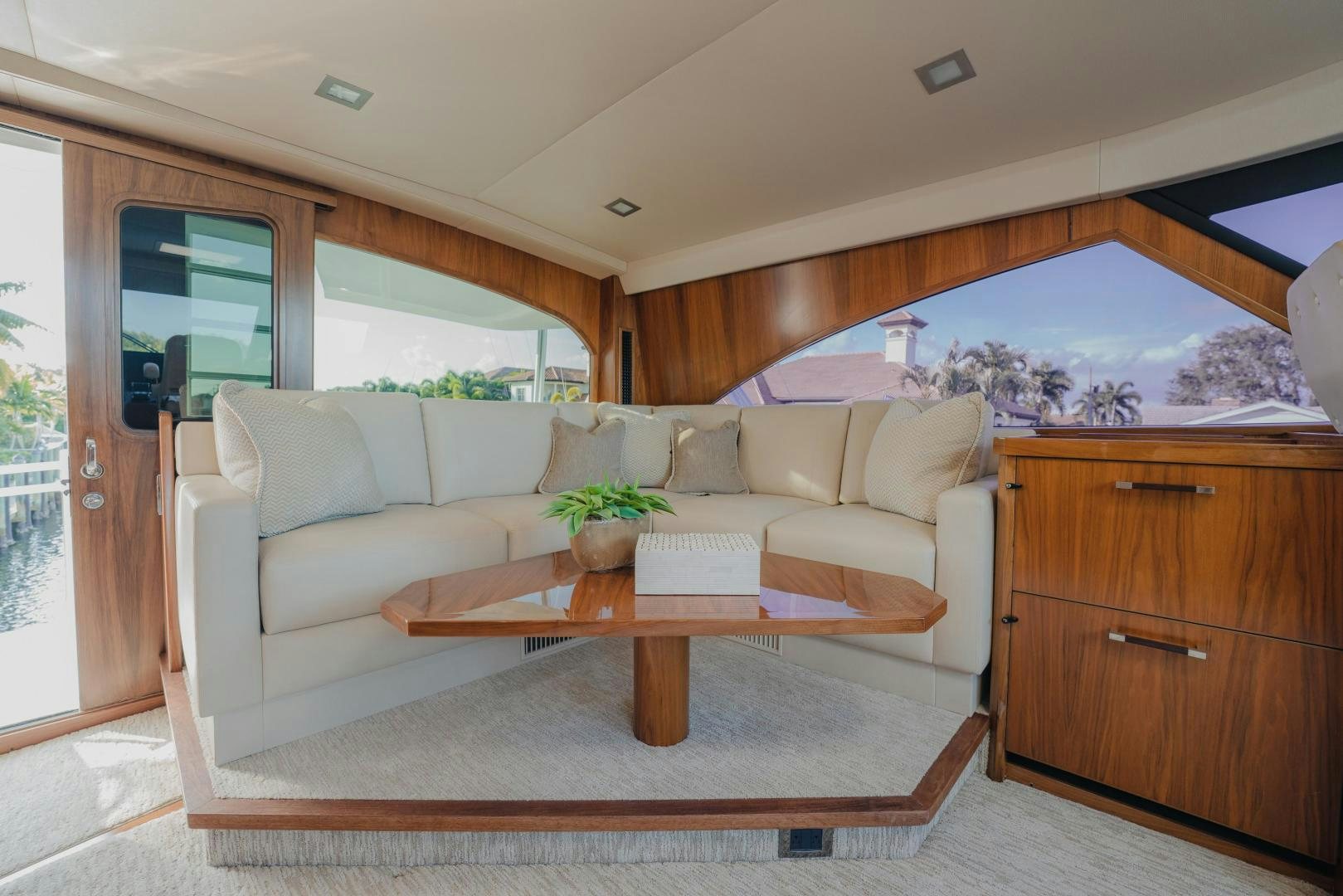 a living room with a couch and a coffee table aboard AUSPICIOUS Yacht for Sale