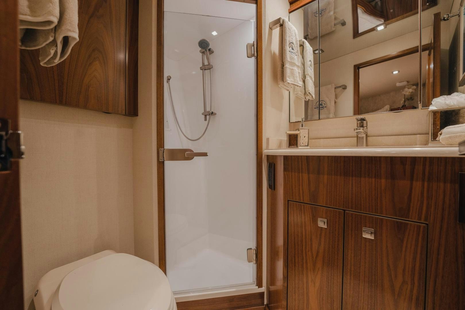 a bathroom with a toilet and a sink aboard AUSPICIOUS Yacht for Sale
