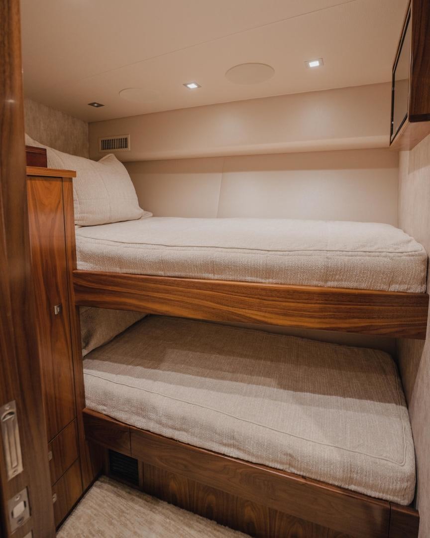 a bed with white sheets aboard AUSPICIOUS Yacht for Sale