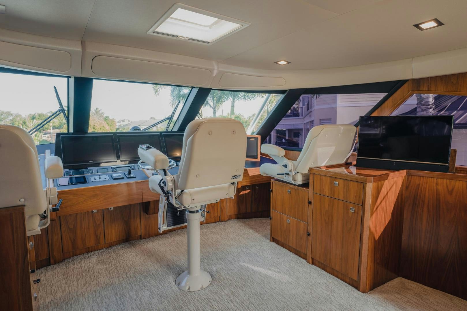 a room with a desk and a television aboard AUSPICIOUS Yacht for Sale