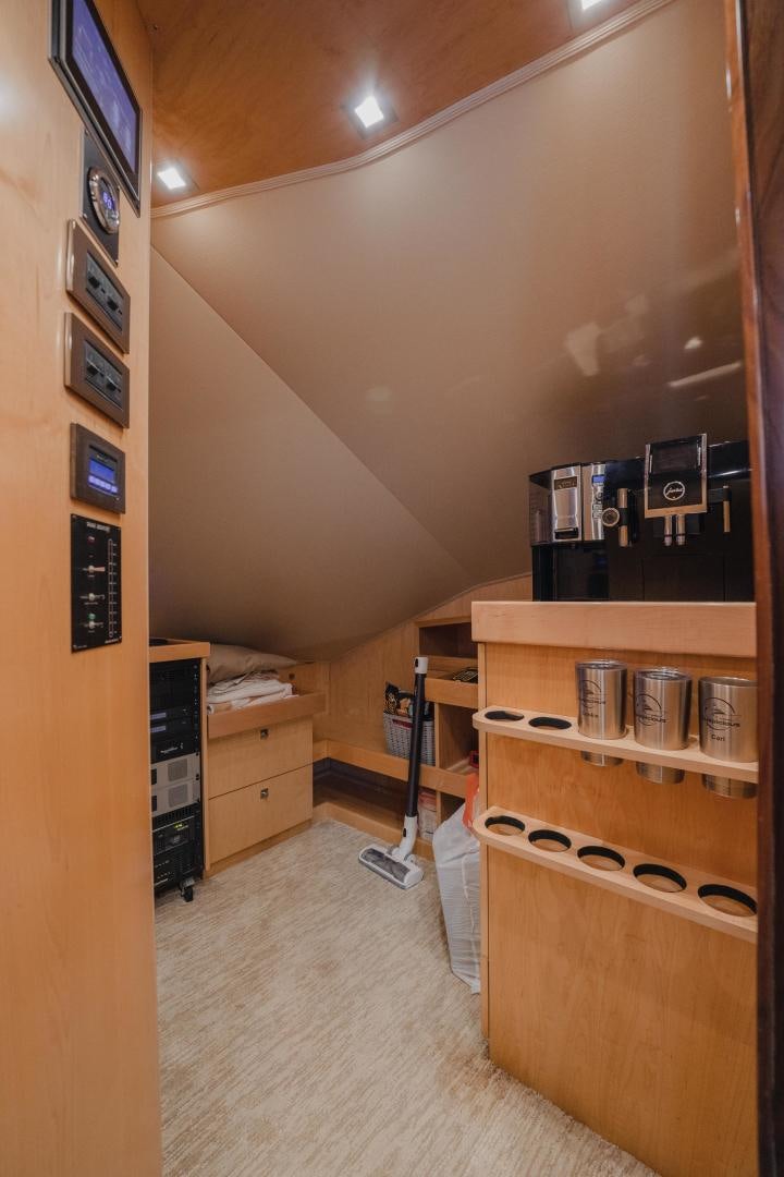 a room with a computer and shelves aboard AUSPICIOUS Yacht for Sale