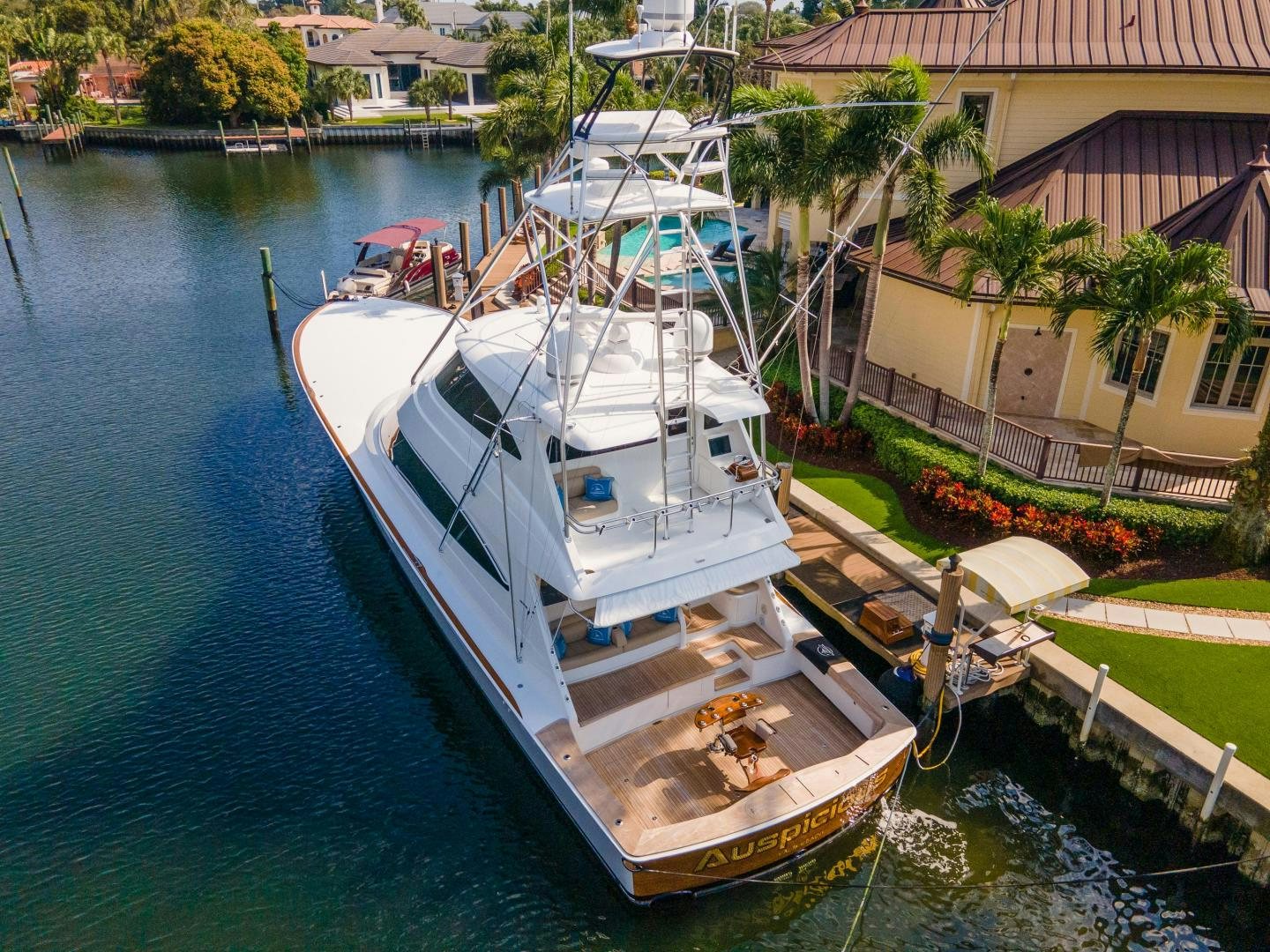 a boat docked in a harbor aboard AUSPICIOUS Yacht for Sale
