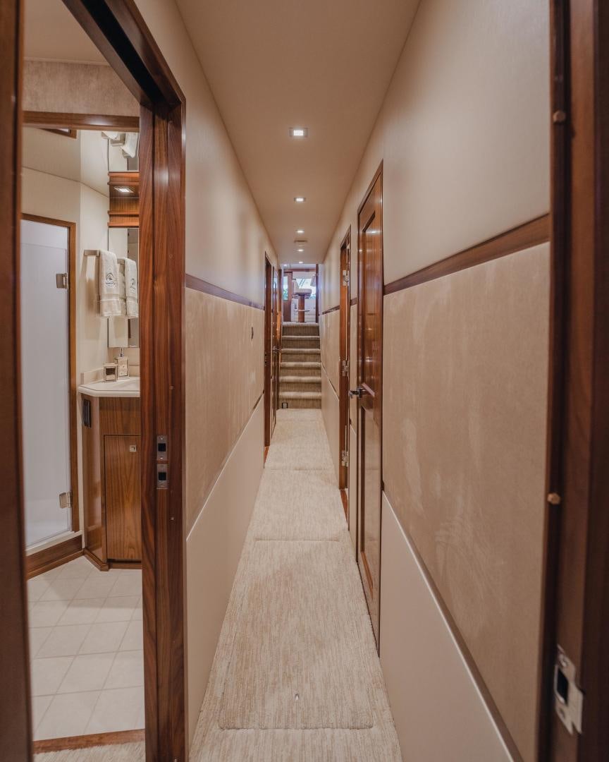 a hallway with a door and a hallway aboard AUSPICIOUS Yacht for Sale