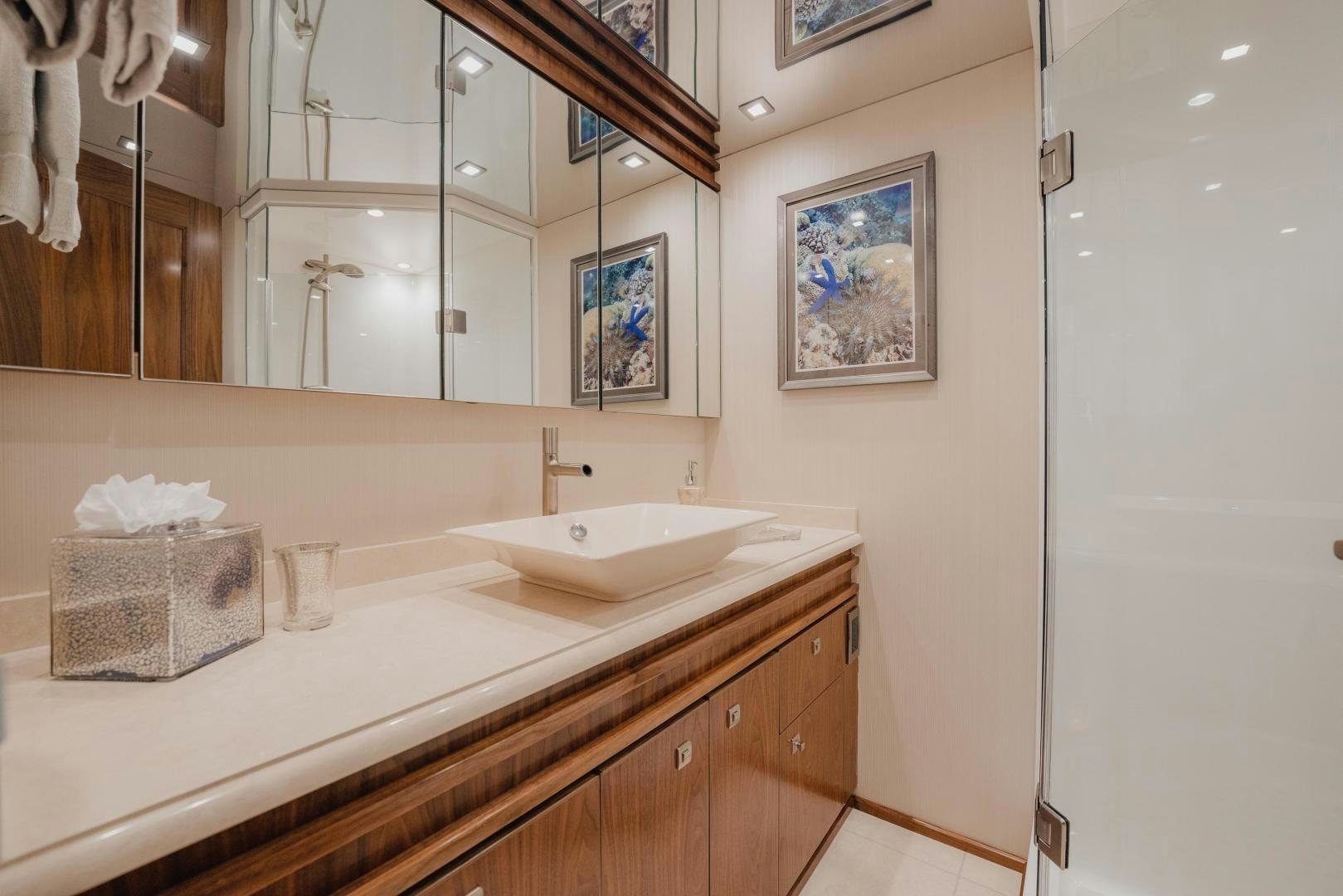 a bathroom with a large mirror aboard AUSPICIOUS Yacht for Sale