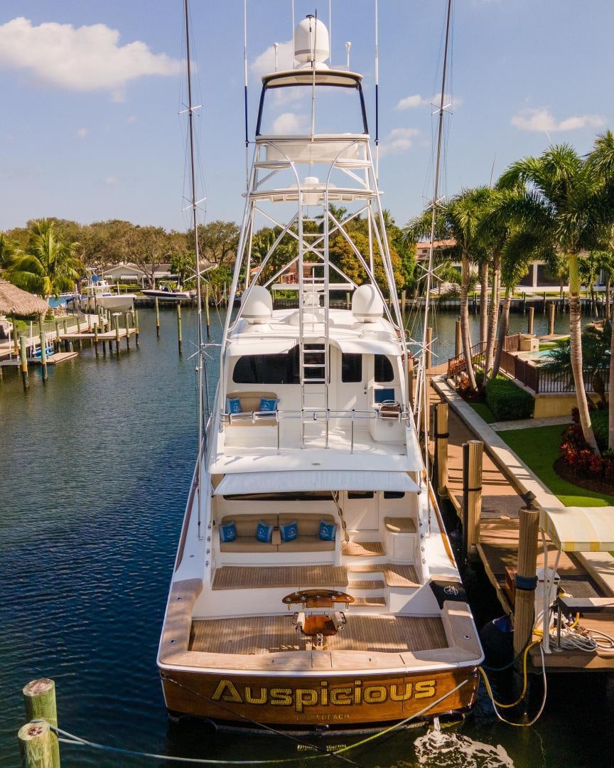 a boat is parked in the water aboard AUSPICIOUS Yacht for Sale