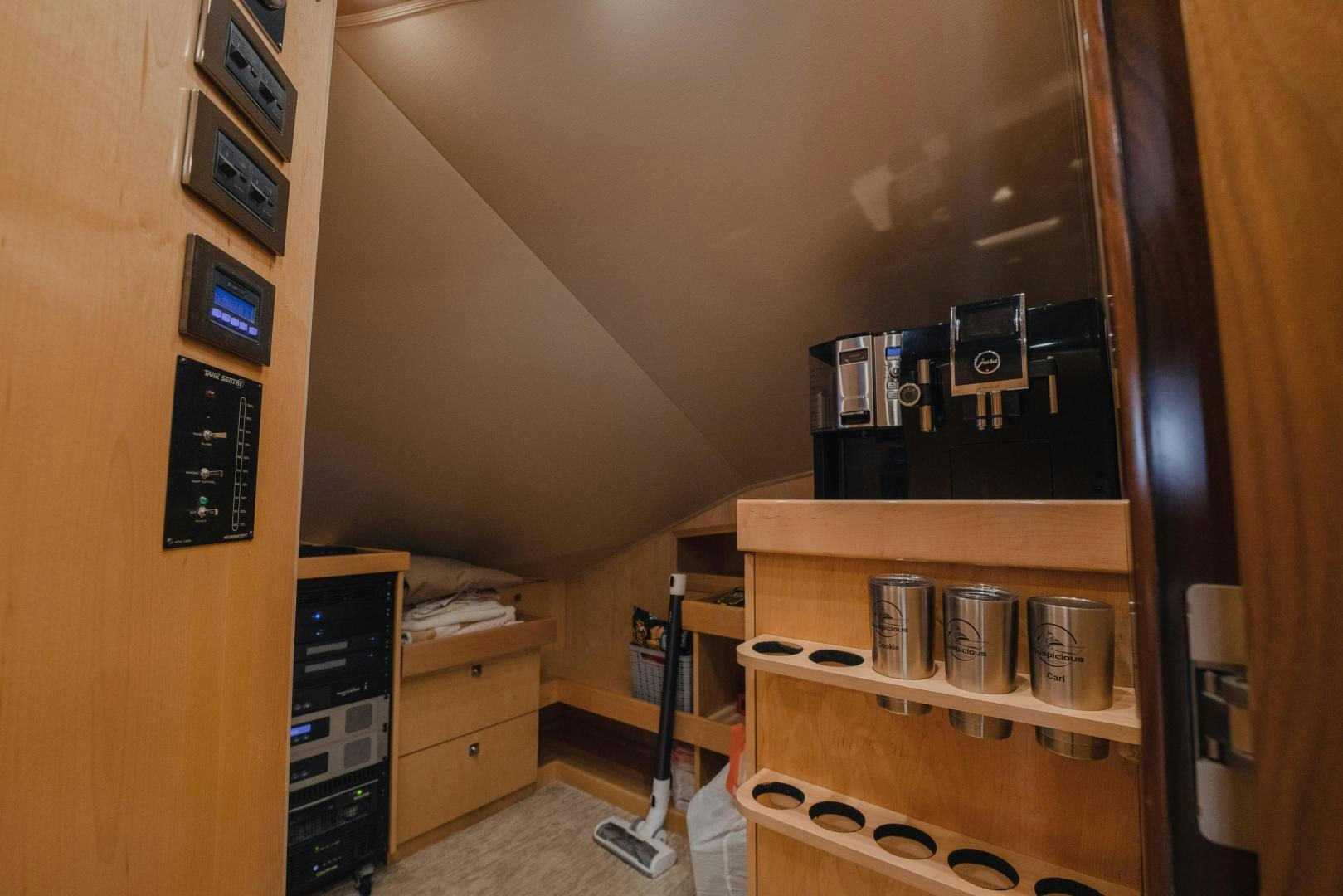 a room with a shelf and electronic equipment aboard AUSPICIOUS Yacht for Sale