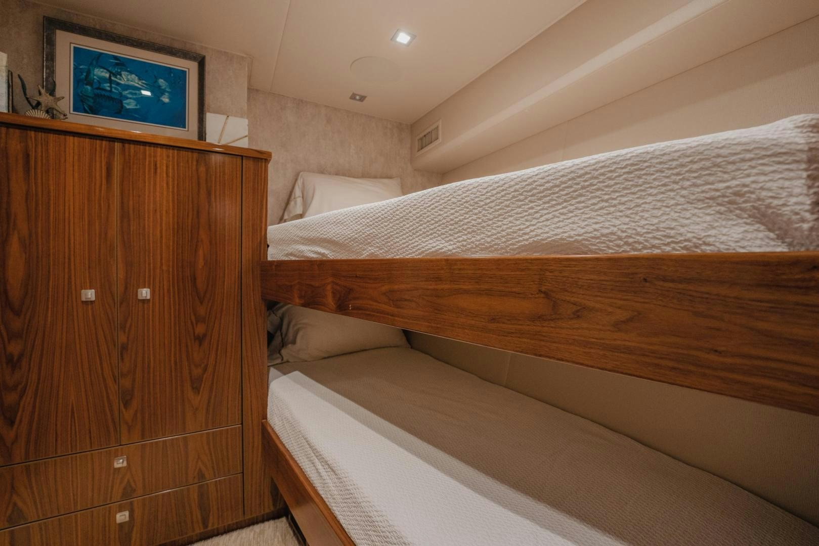 a room with a bed and a television aboard AUSPICIOUS Yacht for Sale