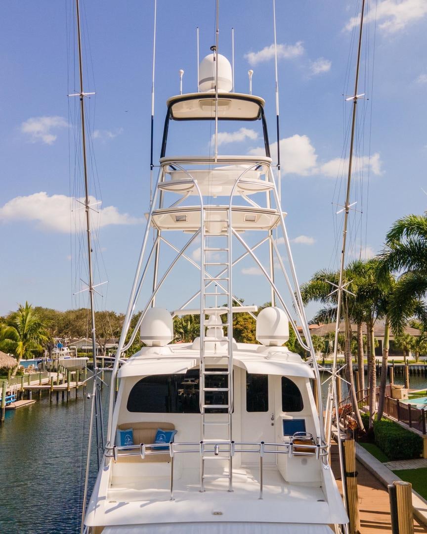 a white boat in a harbor aboard AUSPICIOUS Yacht for Sale
