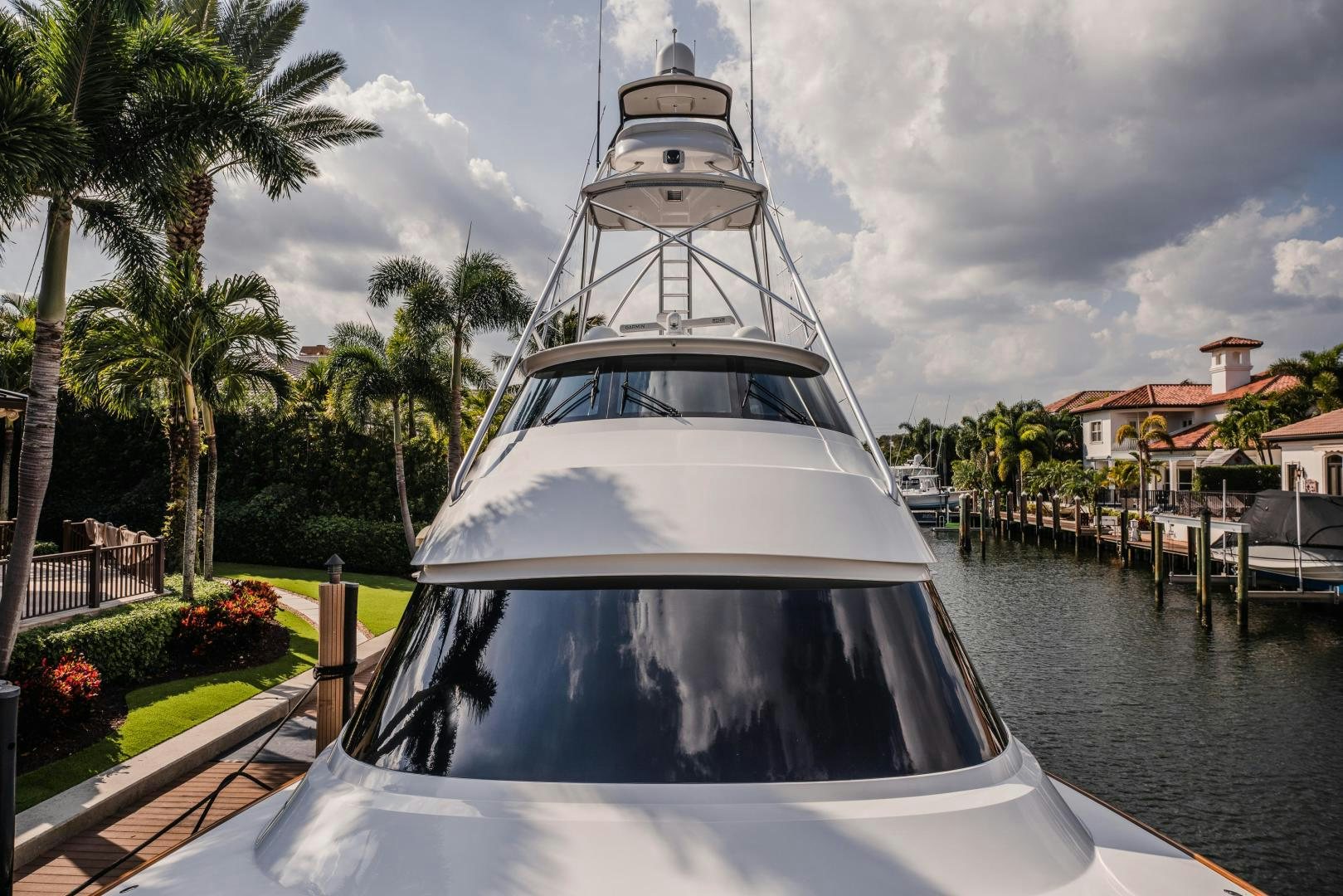a white boat on a dock aboard AUSPICIOUS Yacht for Sale