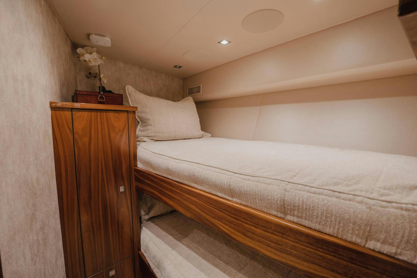 a bed with a white comforter aboard AUSPICIOUS Yacht for Sale