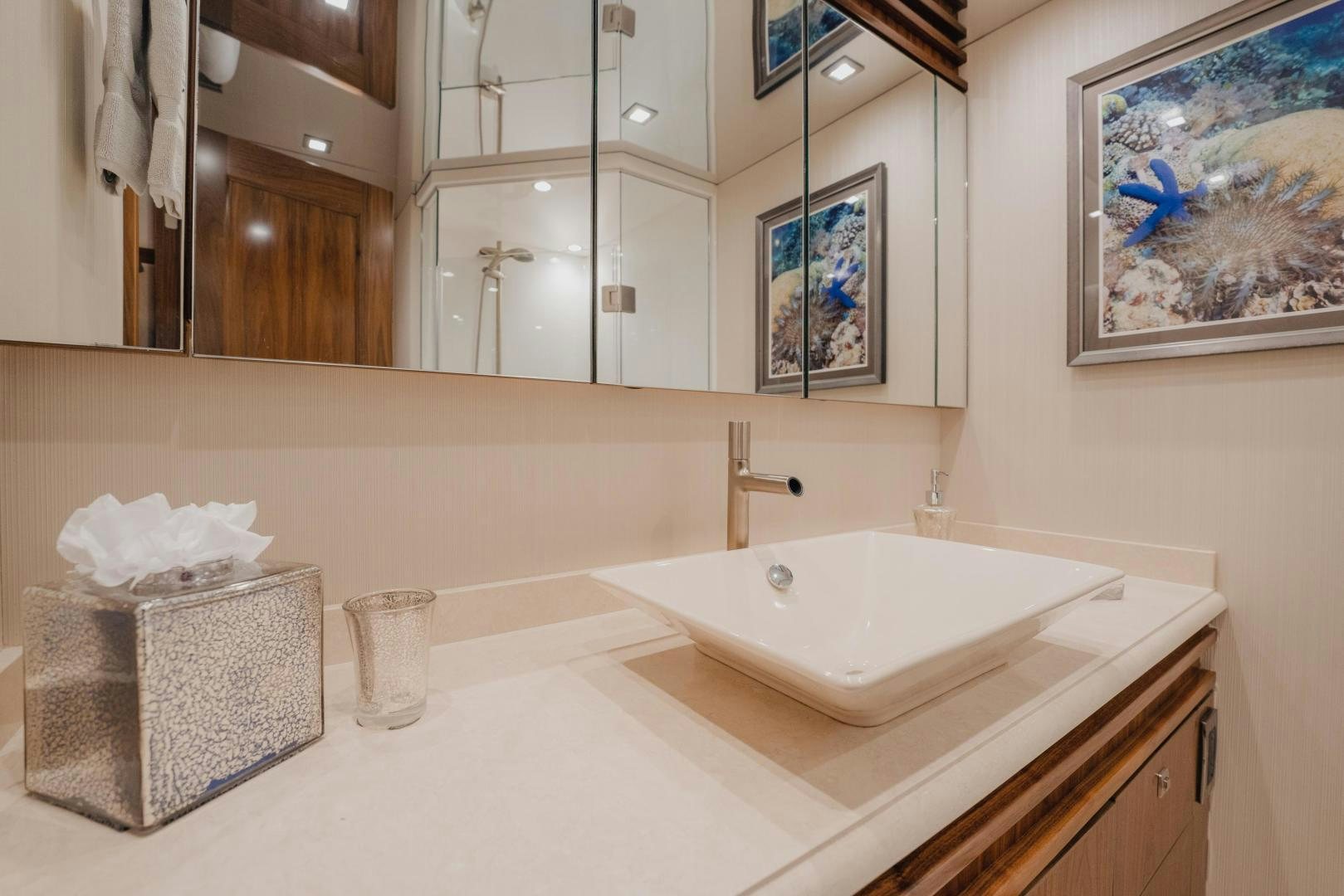 a bathroom with a large mirror aboard AUSPICIOUS Yacht for Sale