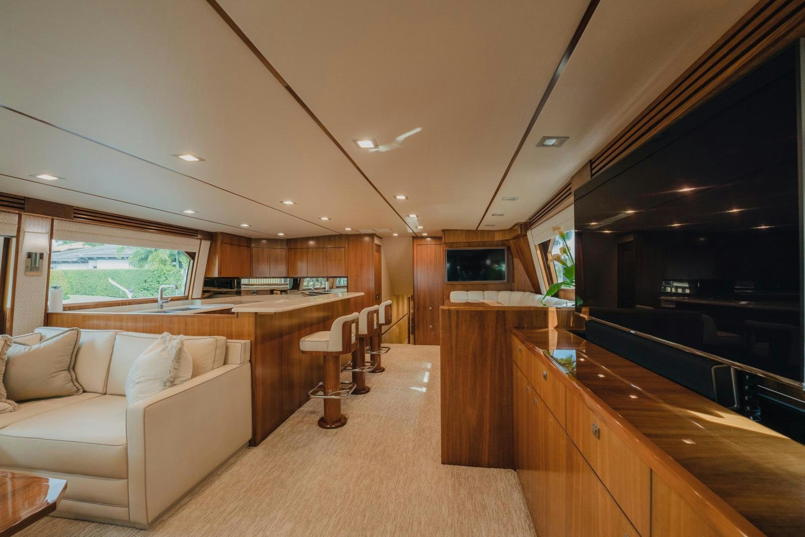 a living room with a couch and a television aboard AUSPICIOUS Yacht for Sale