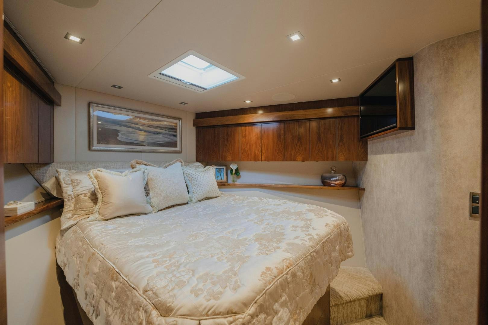 a bed with white sheets aboard AUSPICIOUS Yacht for Sale