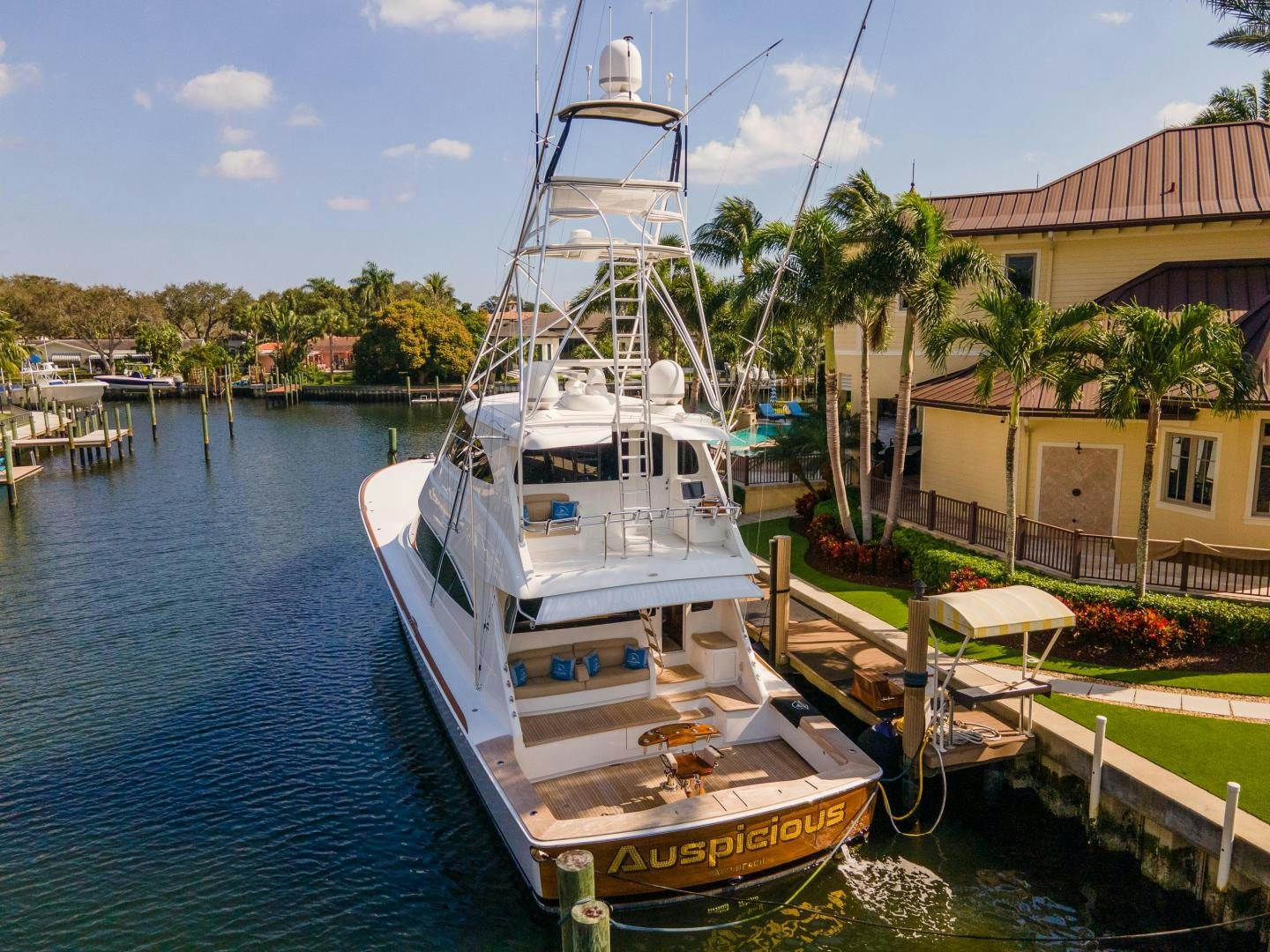 a boat docked at a pier aboard AUSPICIOUS Yacht for Sale