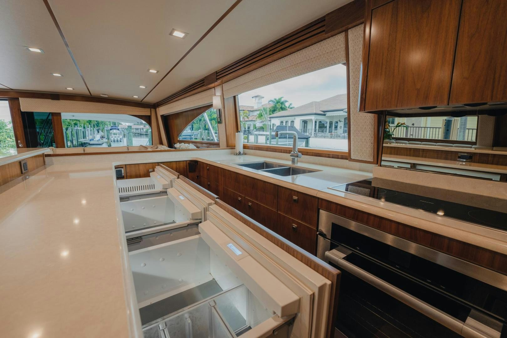 a kitchen with a large island aboard AUSPICIOUS Yacht for Sale