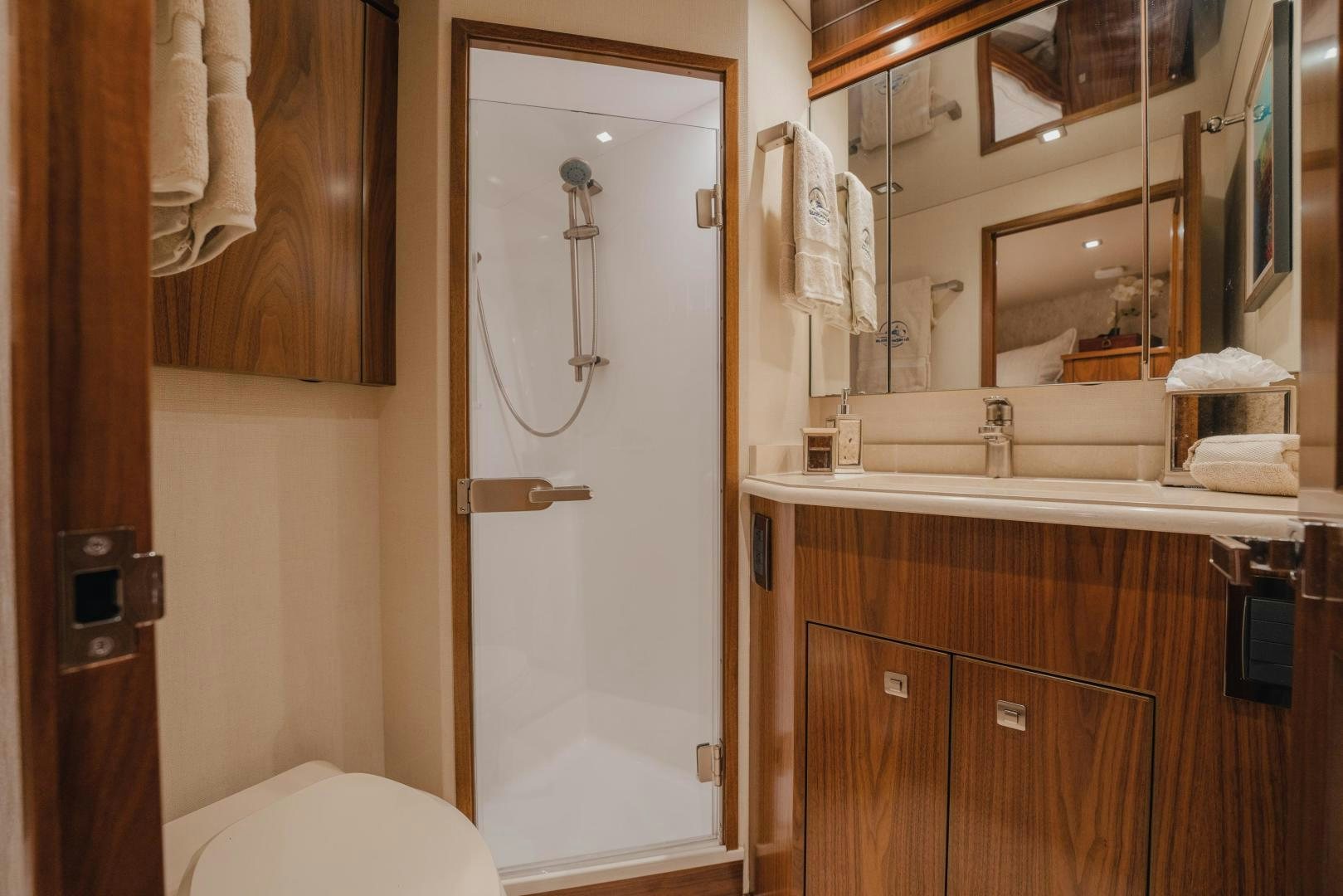 a bathroom with a large mirror aboard AUSPICIOUS Yacht for Sale