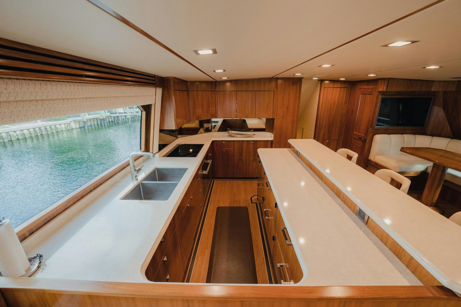 a kitchen with a large island aboard AUSPICIOUS Yacht for Sale