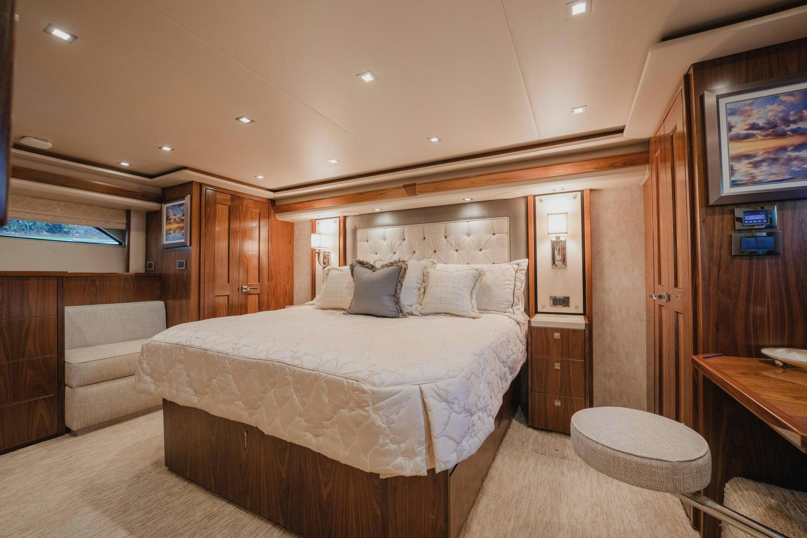 a bedroom with a bed and a desk aboard AUSPICIOUS Yacht for Sale