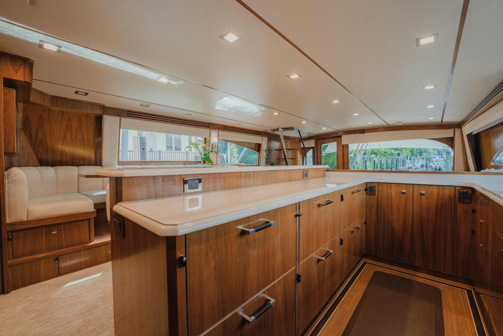 a kitchen with wooden cabinets aboard AUSPICIOUS Yacht for Sale