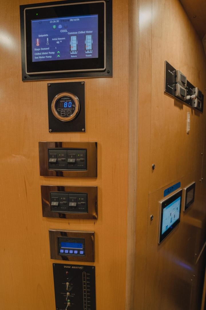 a wall with several electronic devices aboard AUSPICIOUS Yacht for Sale