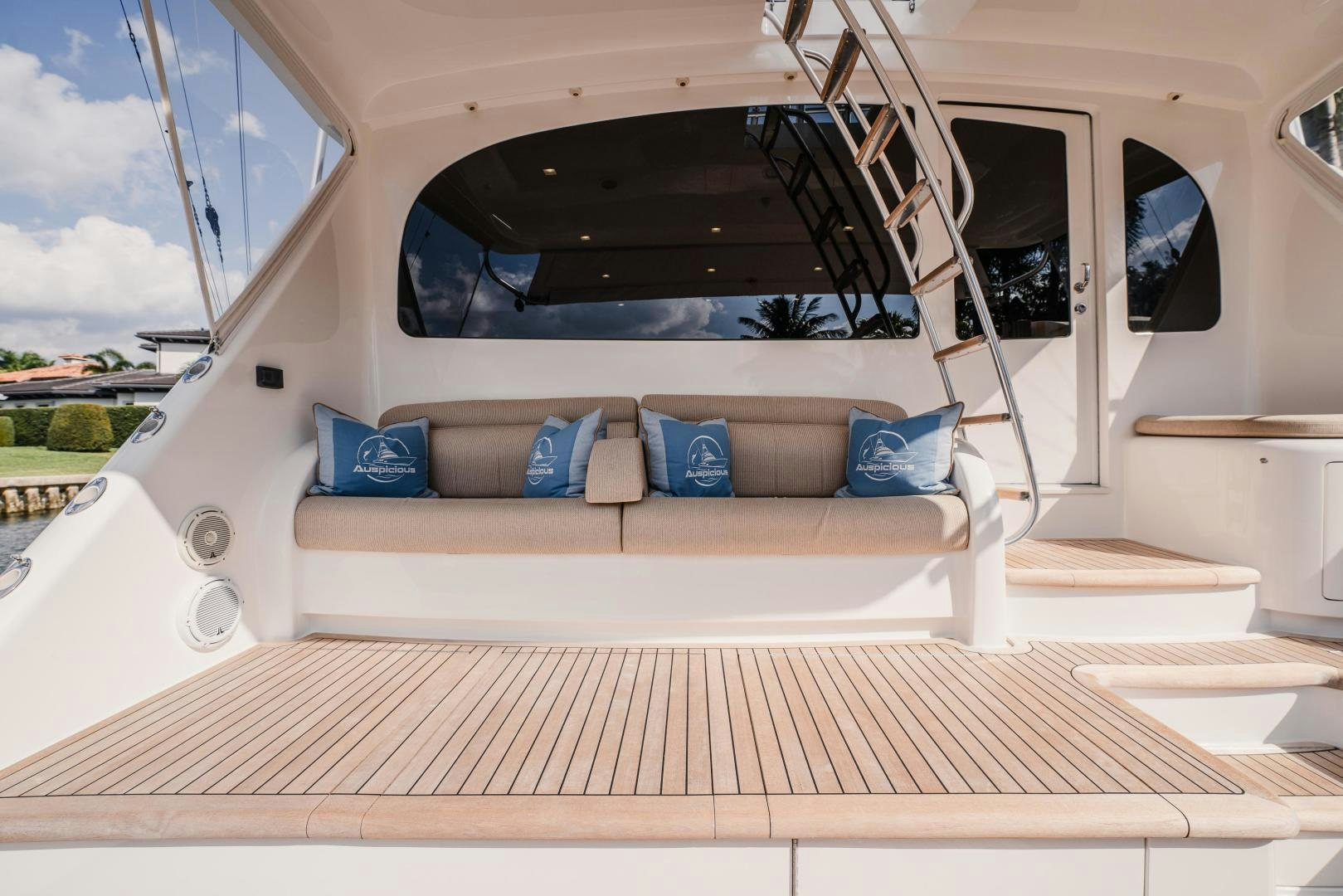 a white car with blue pillows aboard AUSPICIOUS Yacht for Sale