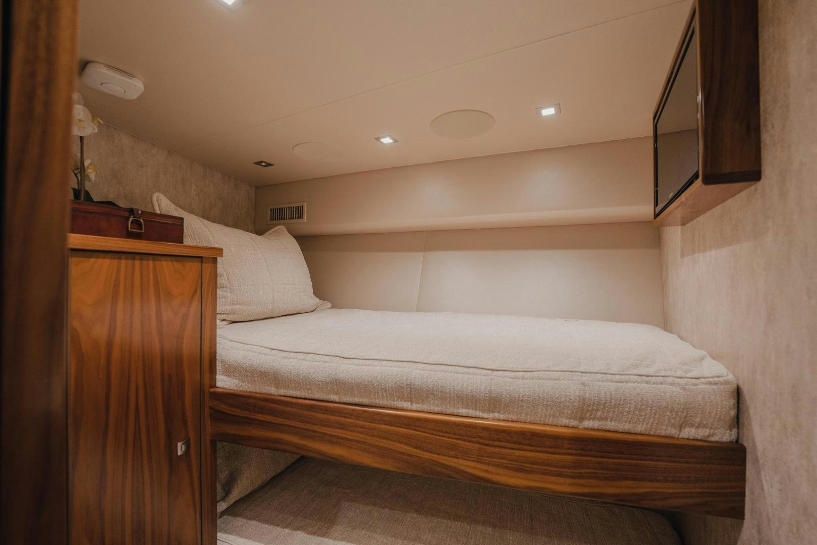 a bed with a white sheet aboard AUSPICIOUS Yacht for Sale