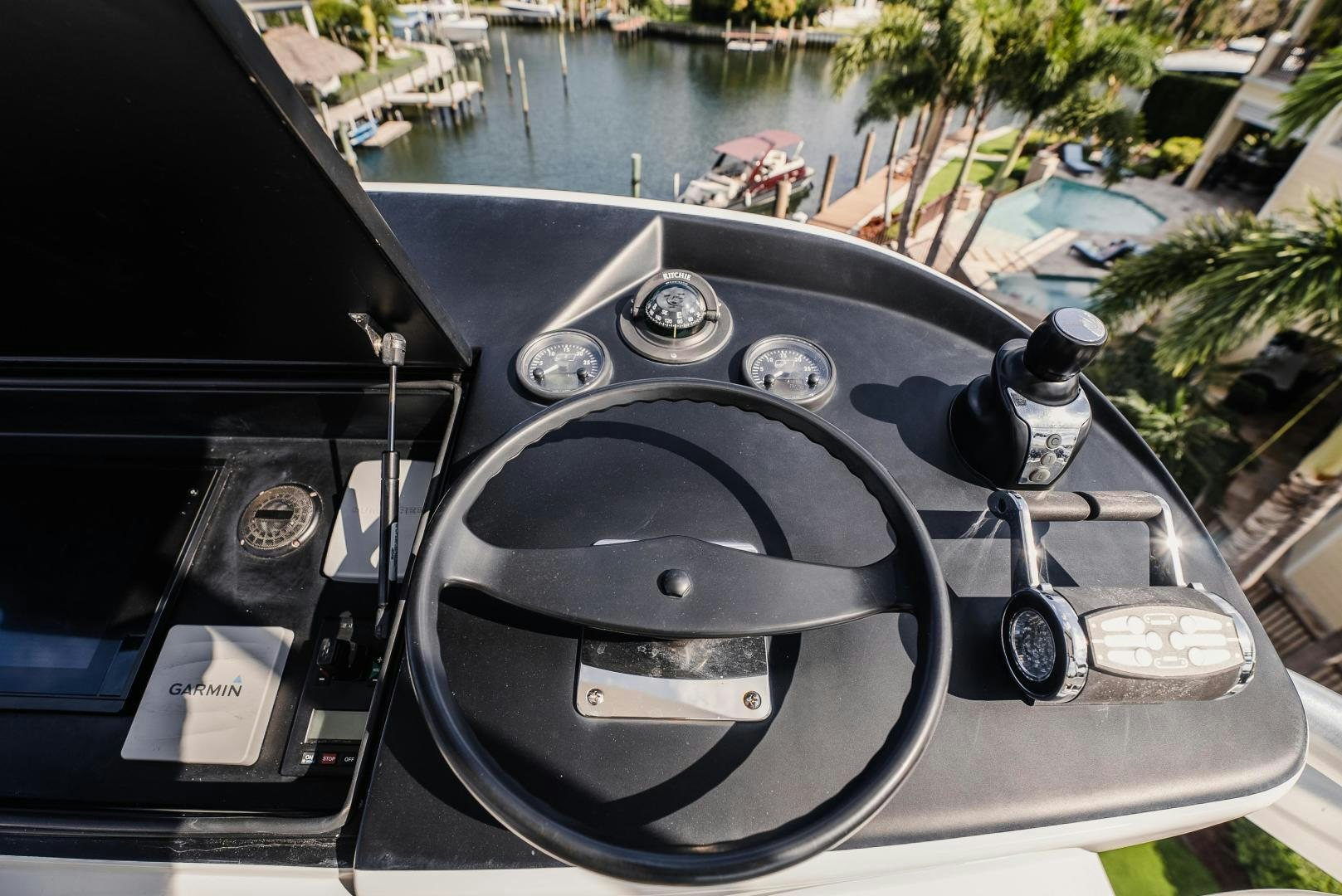the steering wheel and dashboard of a car aboard AUSPICIOUS Yacht for Sale