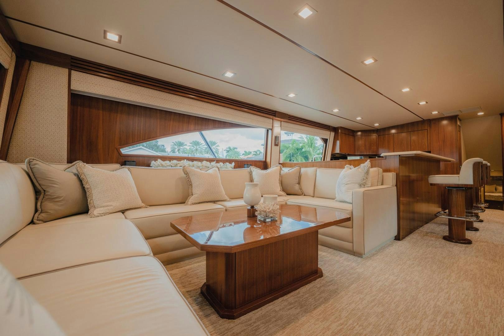 a living room with a large window aboard AUSPICIOUS Yacht for Sale