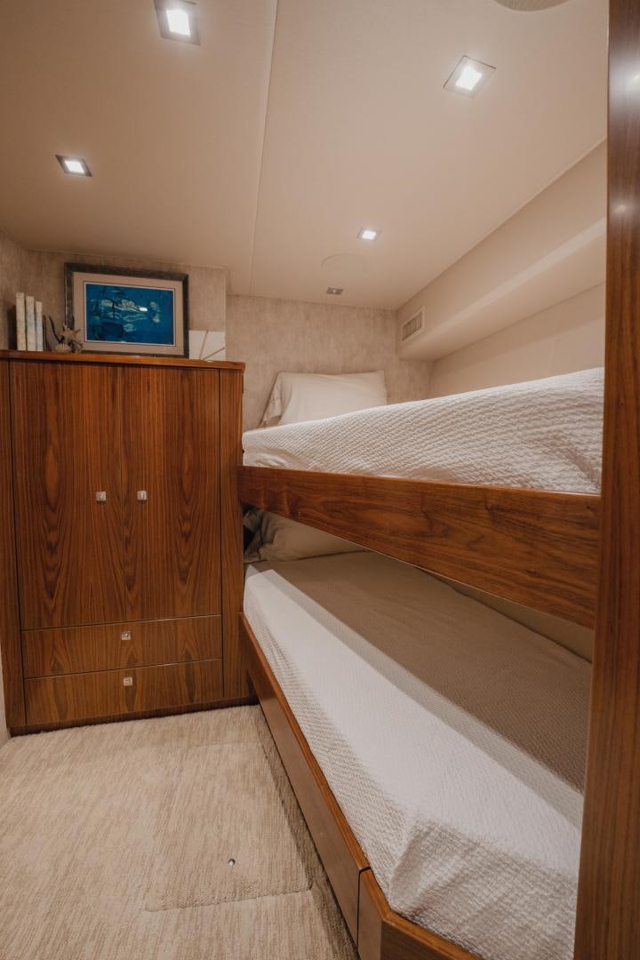 a room with a tv and a bed aboard AUSPICIOUS Yacht for Sale