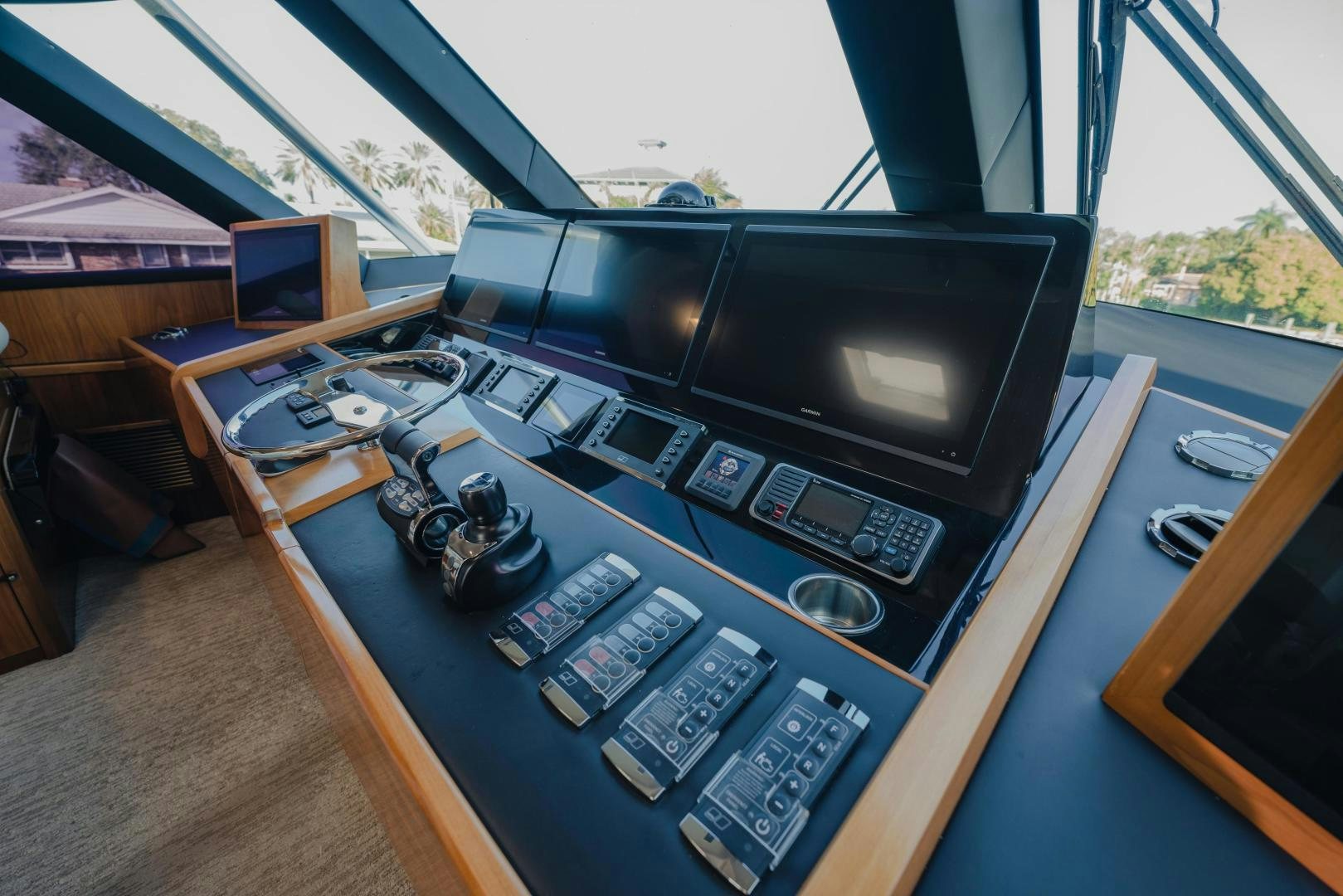 a table with a computer and other electronics on it aboard AUSPICIOUS Yacht for Sale