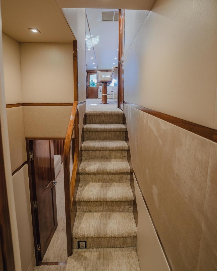 a hallway with a set of stairs aboard AUSPICIOUS Yacht for Sale
