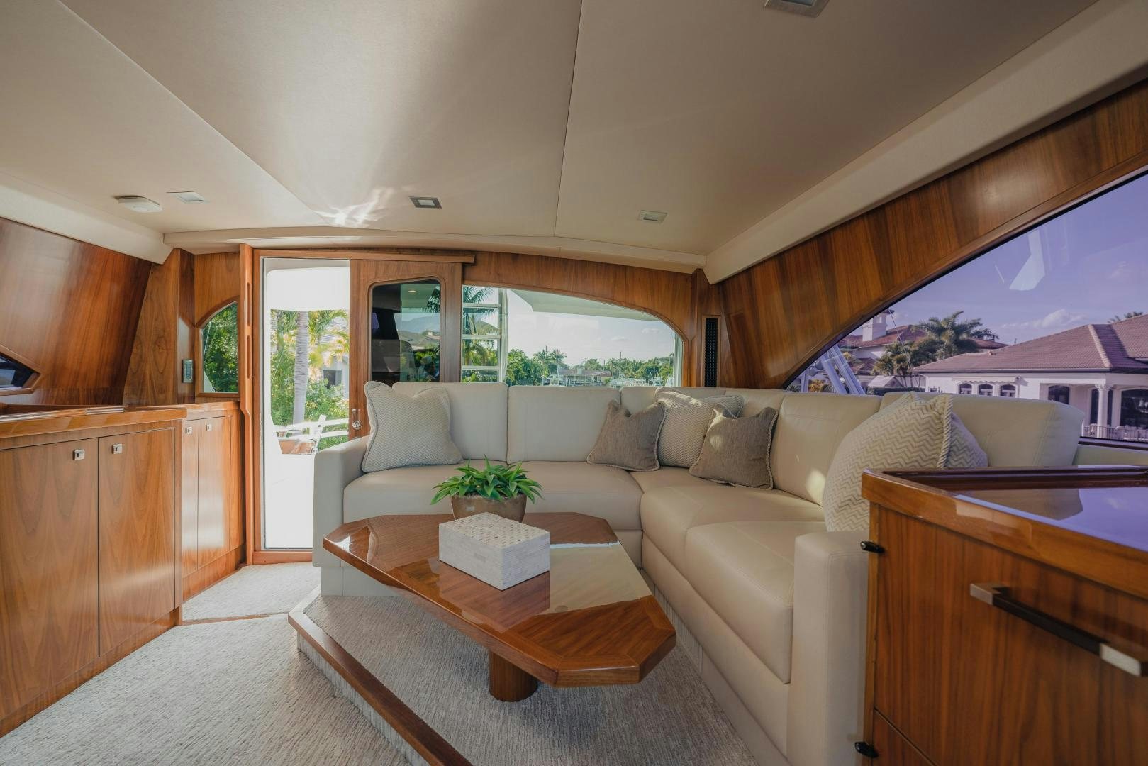 a living room with a couch and a coffee table aboard AUSPICIOUS Yacht for Sale