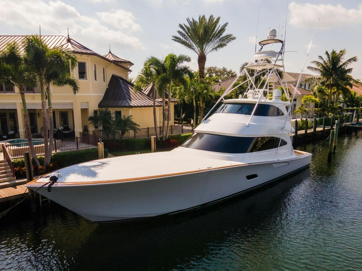 a boat docked at a pier aboard AUSPICIOUS Yacht for Sale
