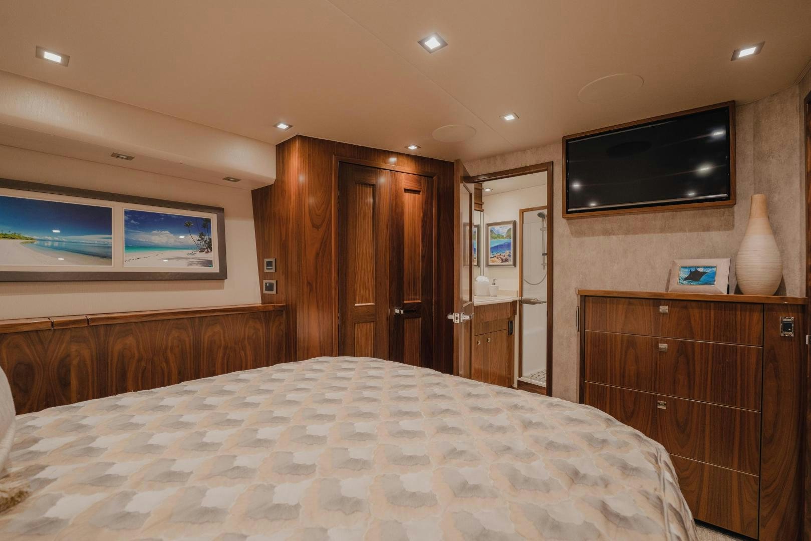 a bedroom with a bed and a television aboard AUSPICIOUS Yacht for Sale