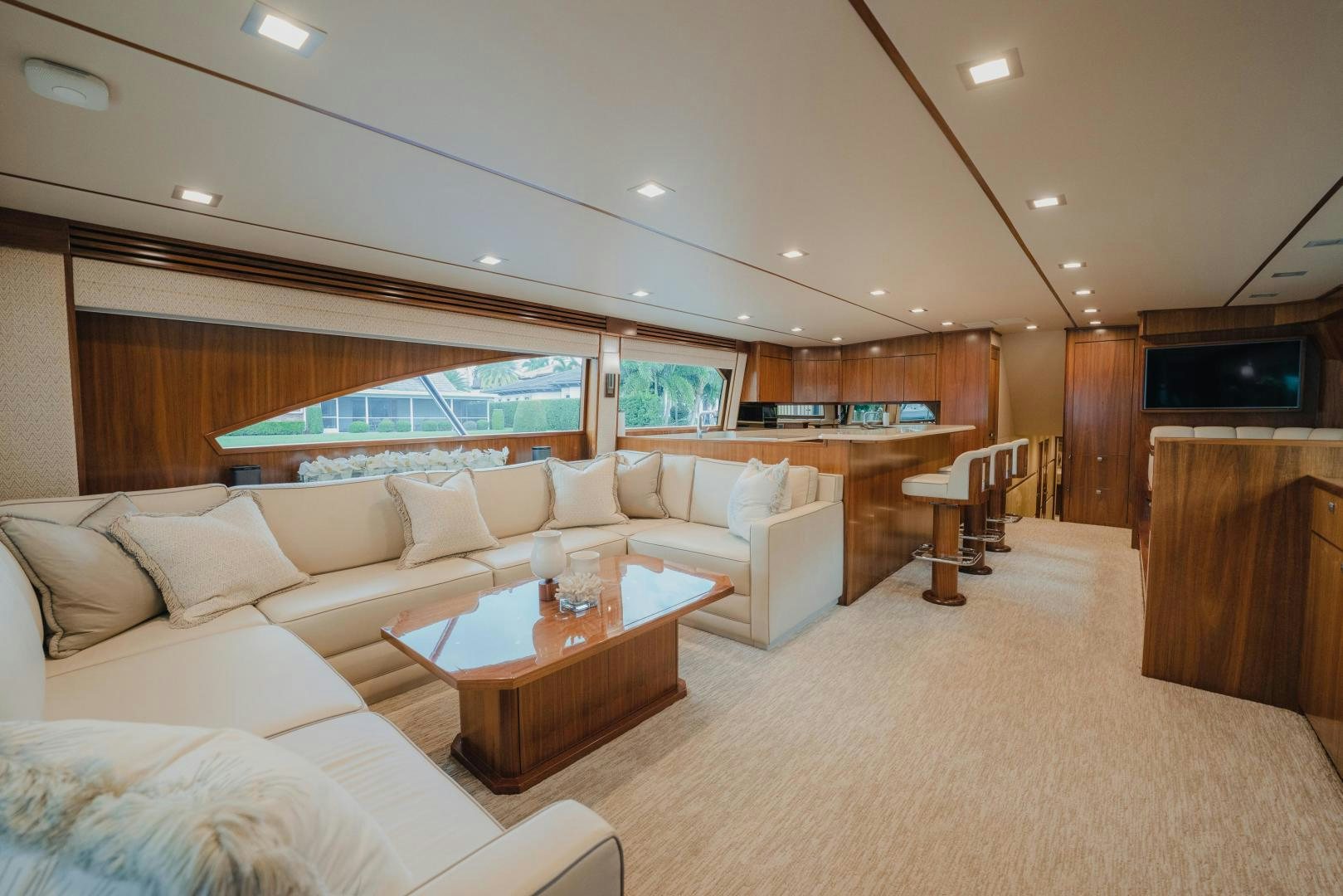 a living room with a large screen aboard AUSPICIOUS Yacht for Sale