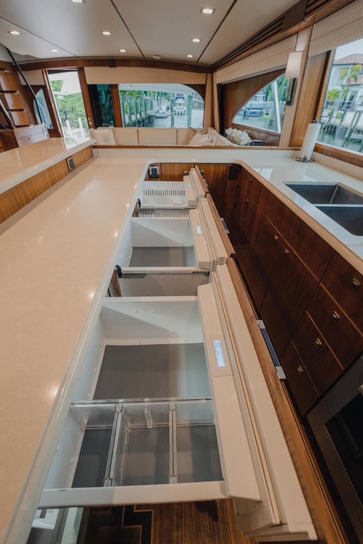 a kitchen with a large island aboard AUSPICIOUS Yacht for Sale