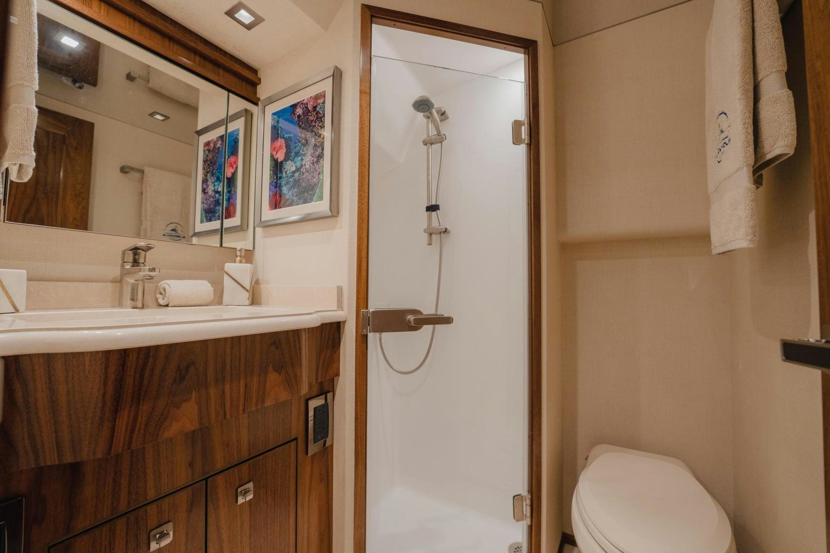 a bathroom with a shower and toilet aboard AUSPICIOUS Yacht for Sale