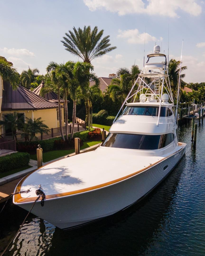 a boat docked at a pier aboard AUSPICIOUS Yacht for Sale