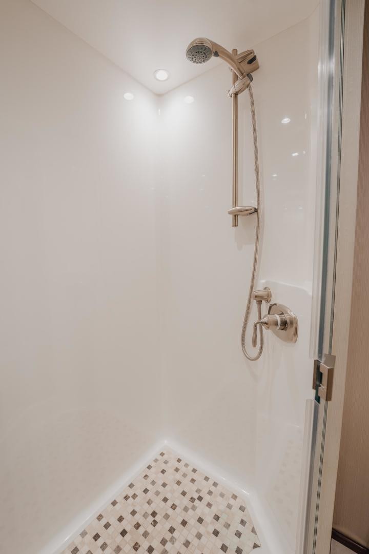 a shower with a tile floor aboard AUSPICIOUS Yacht for Sale