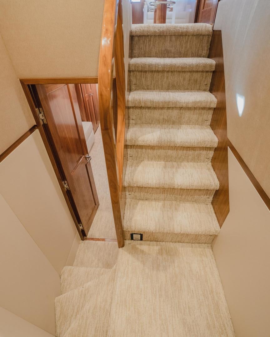 a wooden staircase with a wood frame aboard AUSPICIOUS Yacht for Sale