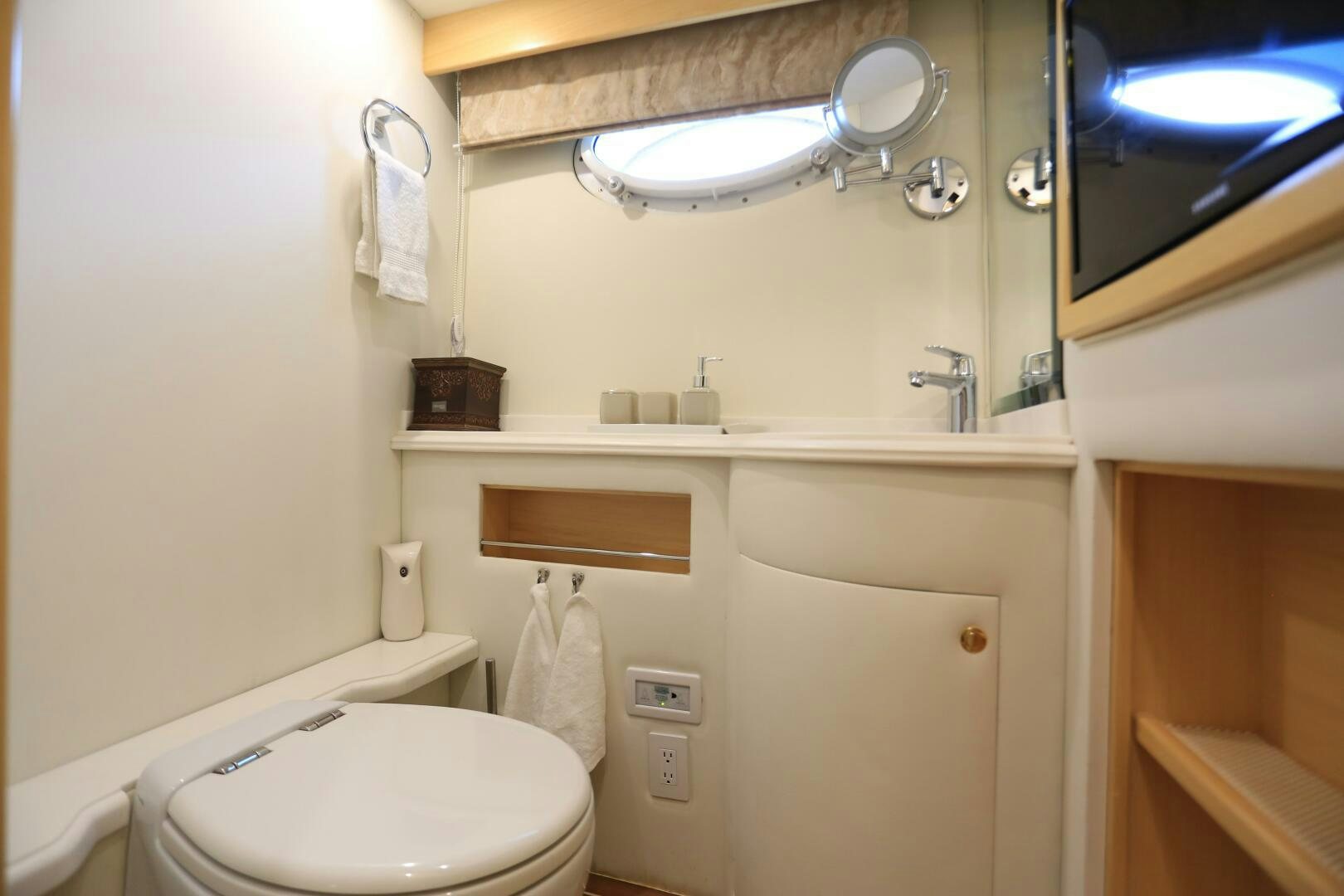 a bathroom with a toilet and a sink aboard FORTY LOVE Yacht for Sale